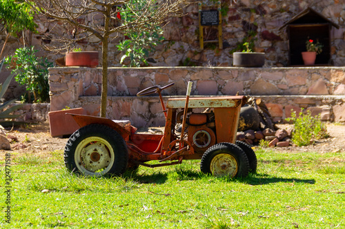 an old retro tractor as a agriculture vehicle