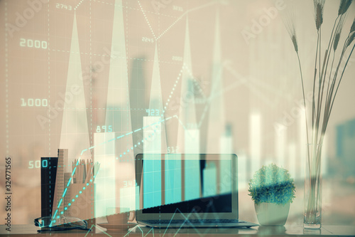 Stock market graph on background with desk and personal computer. Double exposure. Concept of financial analysis. © peshkova