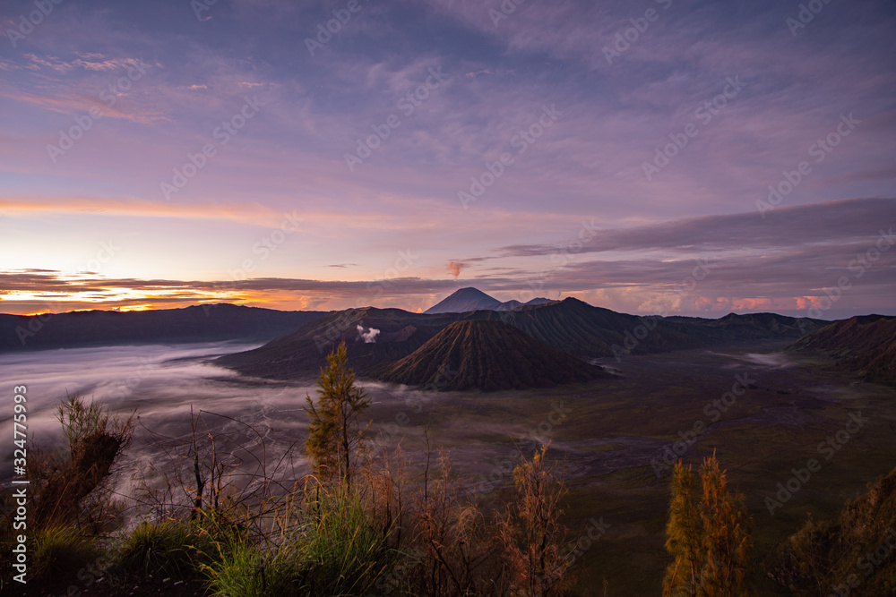 Mount Bromo in Java Indonesia during sunrise early in the morning with beautiful colours and fog