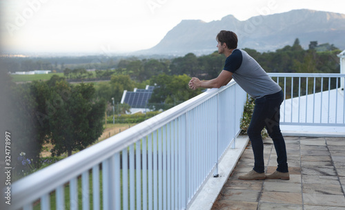 Young man looking away on terrace