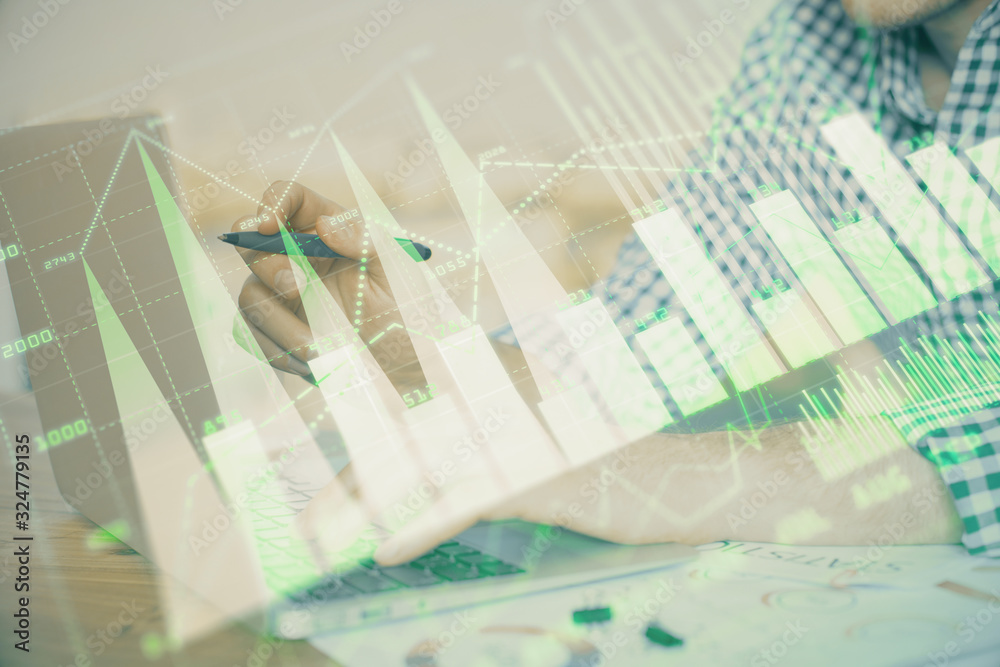 Multi exposure of forex graph with man working on computer on background. Concept of market analysis. Multi exposure of forex graph with man working on computer on background. Concept of market analysis.