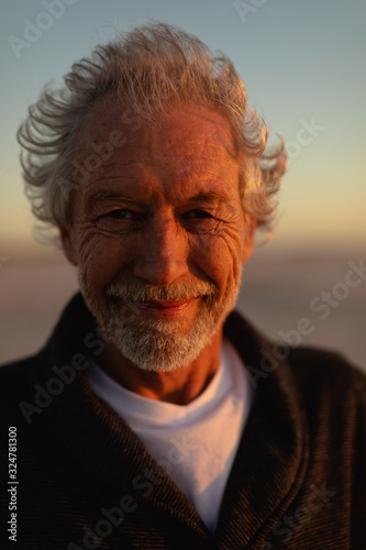 Old man relaxing at the beach