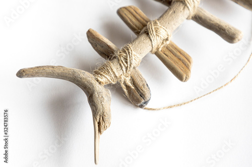 wood-made fish on a white background
