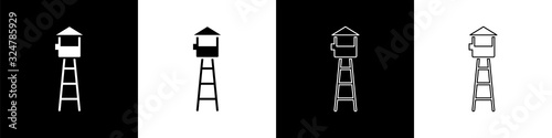 Set Watch tower icon isolated on black and white background. Prison tower, checkpoint, protection territory, state border, military base. Vector Illustration