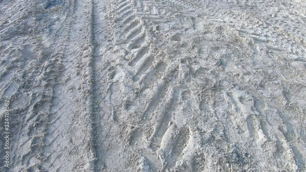 Traces of tractor on sand Traces of tractor on sand