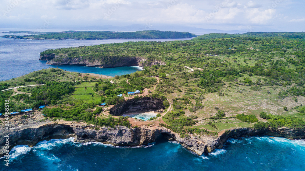 Stunning aerial view of the Broken Beach. Broken Beach locally known as Pantai Pasih Uug is one of the top picturesque and most visited destinations on Nusa Penida Island, Bali, Indonesia.