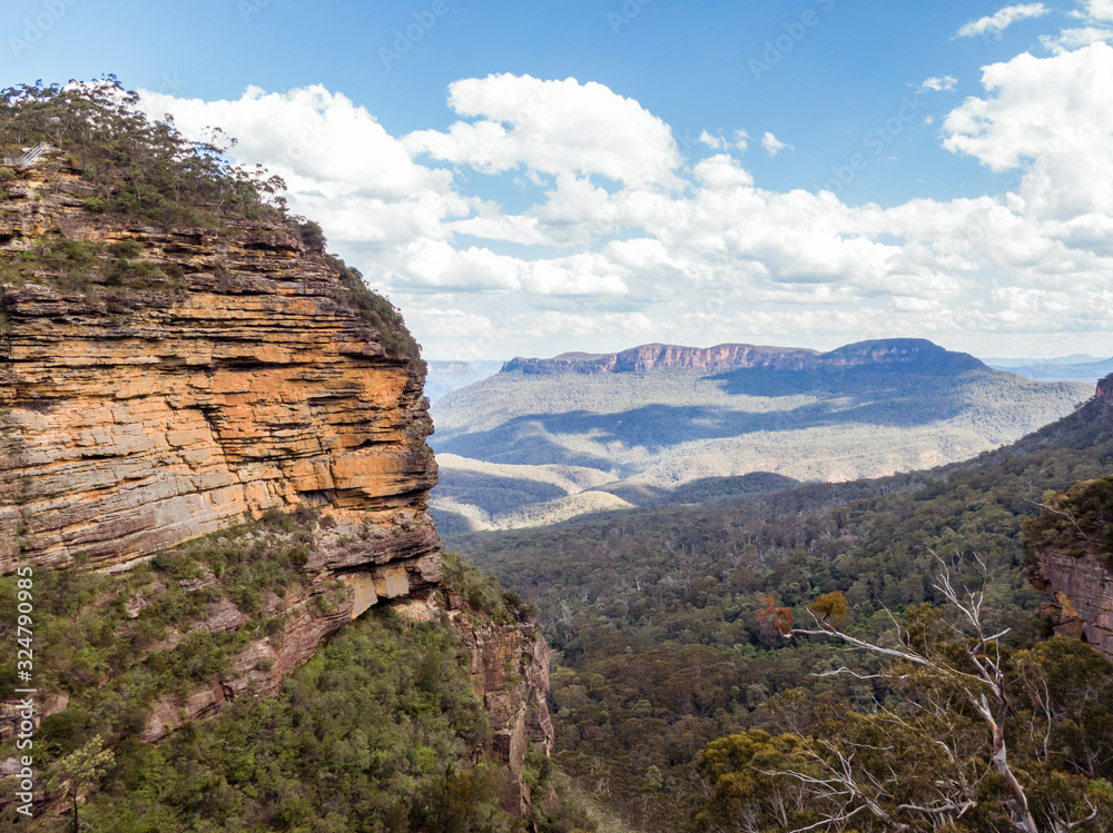 Panoramic Blue Mountains Australia. DRONE. Dramatic views of peaks, rock, valley, landscape, green rainforest jungle. Adventure, freedom, fun concepts. Tourist mountain trek. Shot in Sydney, NSW.