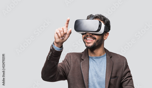 Fototapeta Young man using virtual reality headset, VR, future, gadgets, technology concept 
