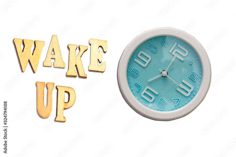 alarm clock showing seven o'clock with wake up wooden text isolated on white alarm clock showing seven o'clock with wake up wooden text isolated on white