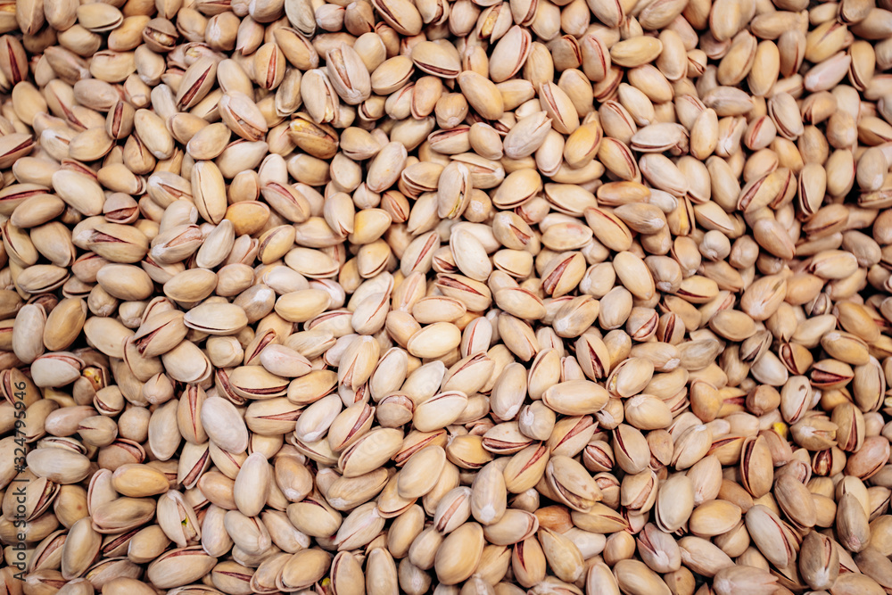 Background make from salt pistachios in a shell. A lot of pistachio nuts Background make from salt pistachios in a shell. A lot of pistachio nuts