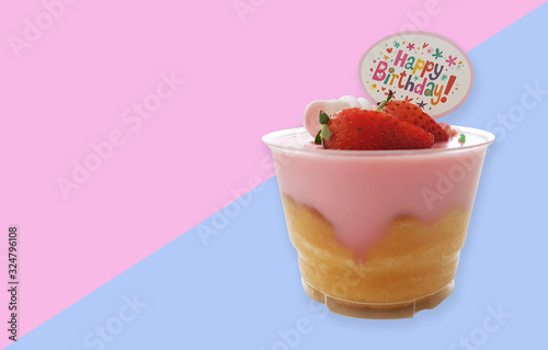 Custard strawberry cup cake birthday on two tone background