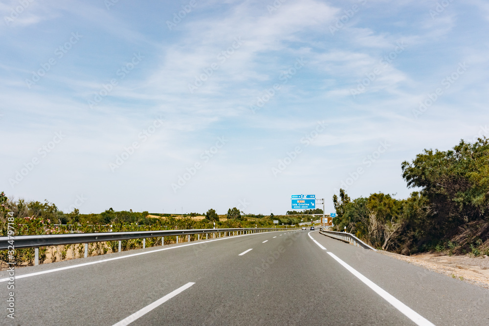 Paved road and beautiful green landscape in summer