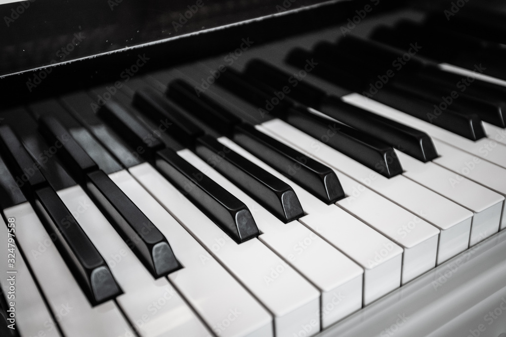 Close-up of black and white piano keys. Close-up of black and white piano keys.