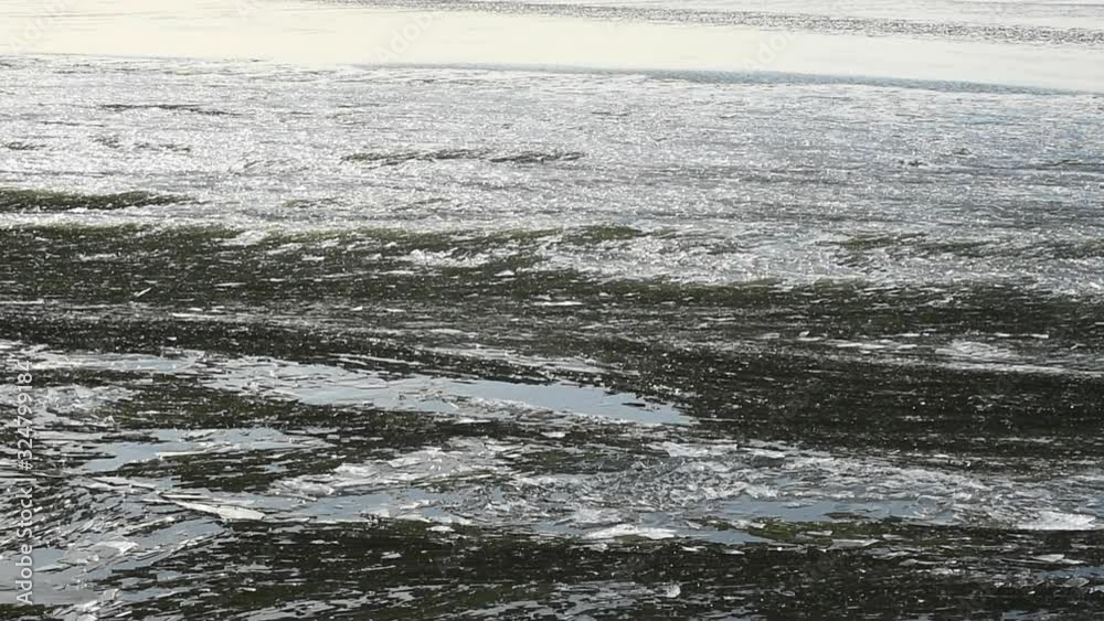 Sheets of ice floating by ice laying still Sheets of ice floating by ice laying still