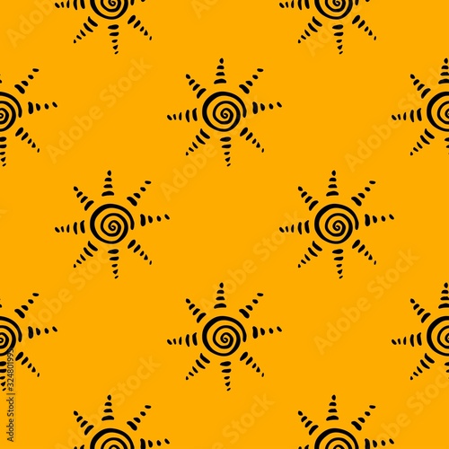 Yellow pattern with hand drawn sun symbol stylized in folk etnic style of ancient culture. Gold on black background. Seamless design. Great for fabric, scrapbooking and textile.