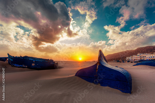 Boat wreck sunset golden hour landscape blue clouds