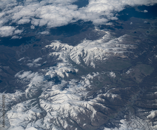 Top View from plane to snow capped peaks of Caucasus Mountains