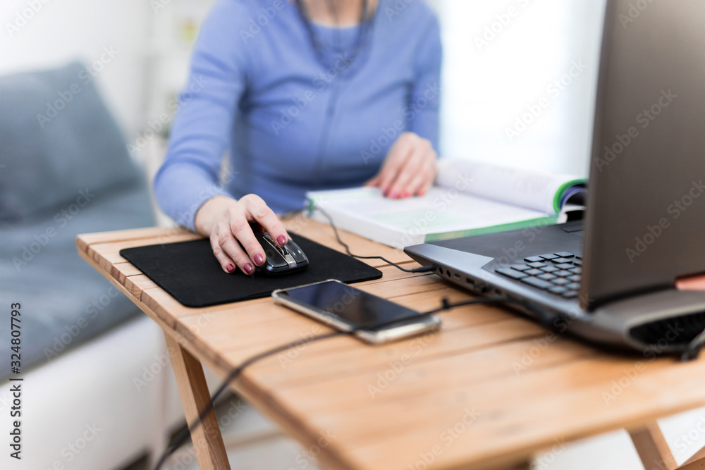 Woman using laptop - freelance job, working on a computer.