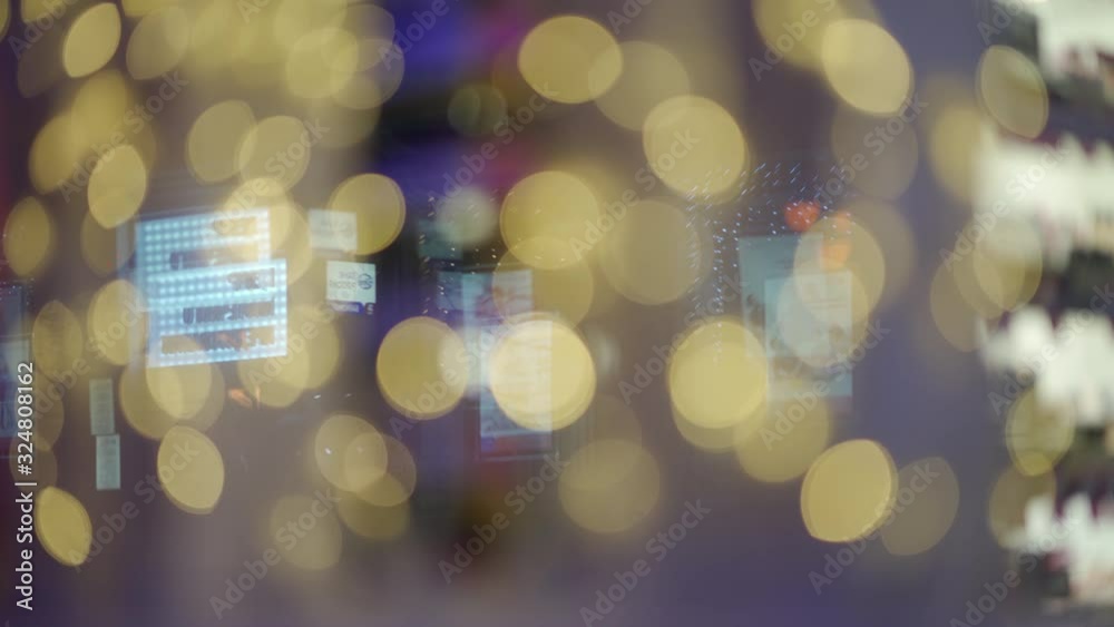 Night city street lights reflected in a shop window display. Night city street lights reflected in a shop window display.