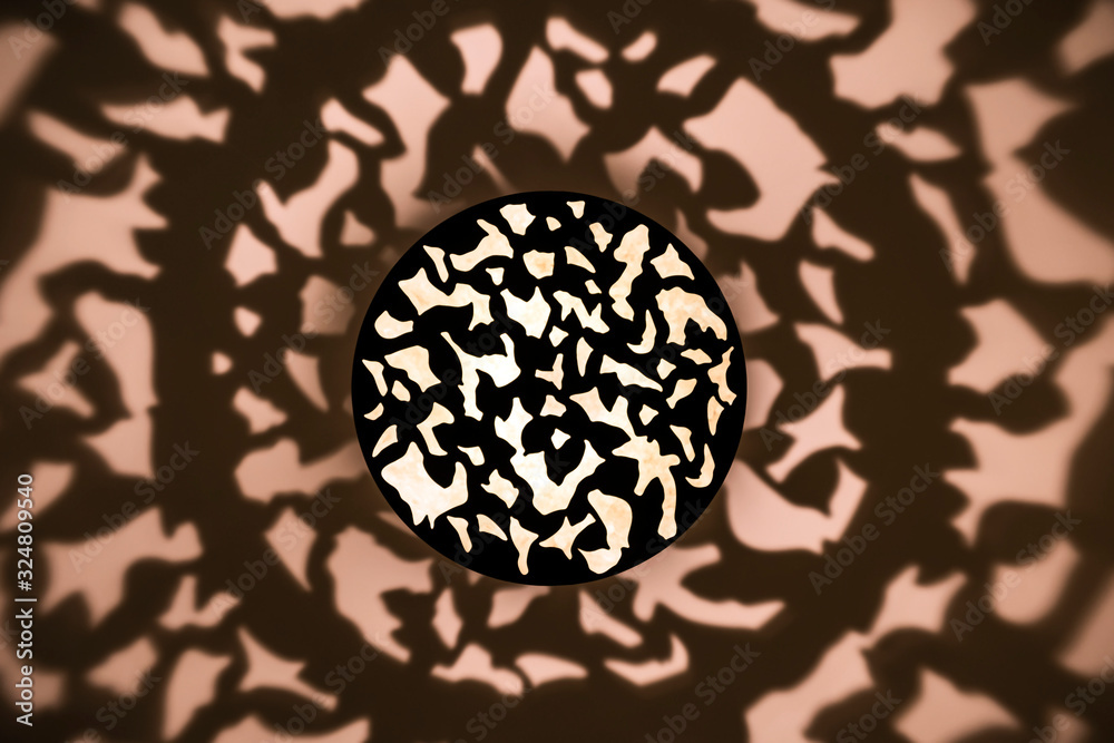 Abstract lights and shadows on ceilling from lamp. Interesting ceiling lamp with beautiful pattern light up with beautiful shadows on ceiling and wall. Abstract lights and shadows on ceilling from lamp. Interesting ceiling lamp with beautiful pattern light up with beautiful shadows on ceiling and wall.