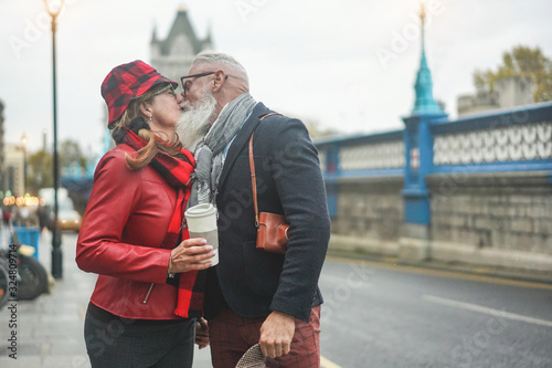 Wallpaper Mural Happy senior couple kissing in London near Tower Bridge - Soft focus on faces Torontodigital.ca