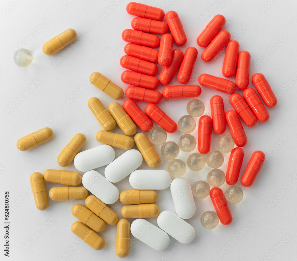 Pile of pills isolated on white background, close up Pile of pills isolated on white background, close up