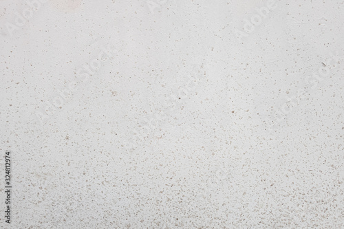 abstract background of an old white wall in drops of dirt