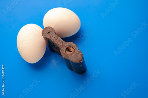 Canvas Print two eggs on lock,blue background,iron Oran in the form of a padlock