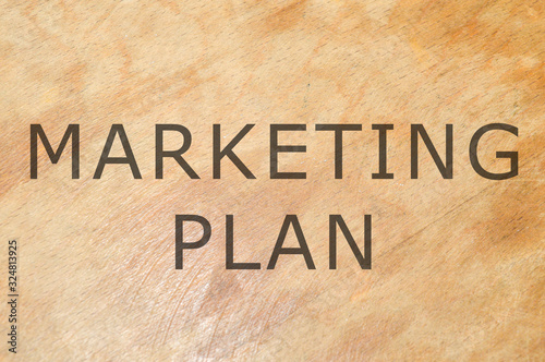 marketing plan written on wooden background