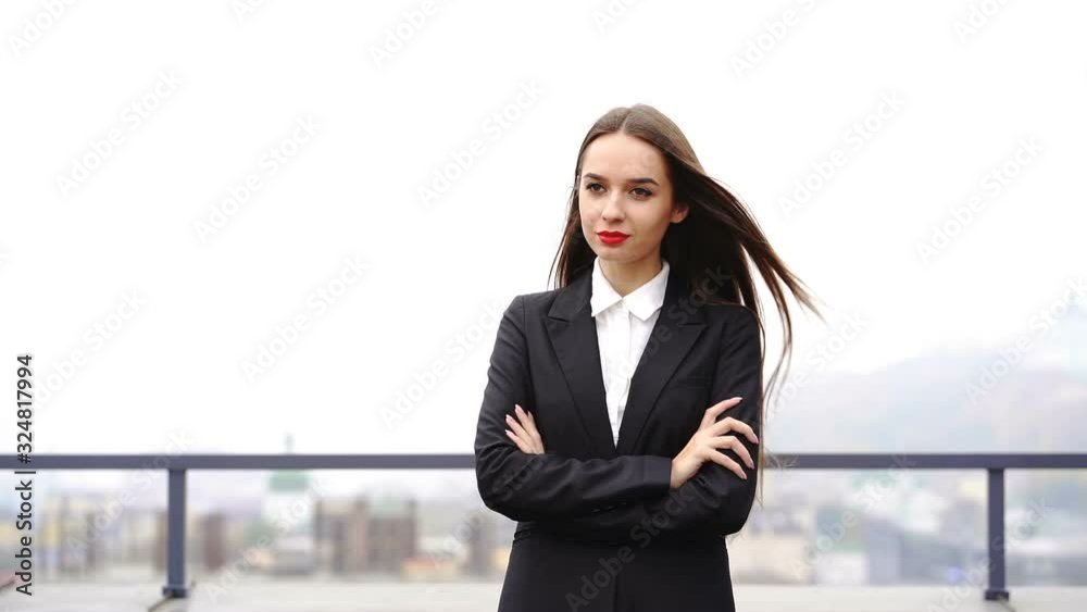 Office work. Pretty young business woman walk in office area Office work. Pretty young business woman walk in office area