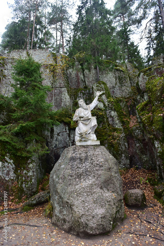 Väinemäinen playing on a kantele - statue of the hero of the epic Kalevala Väinemöijnen with Karelian-Finnish gusli “kantele” on his lap, Mon Repos Park photo