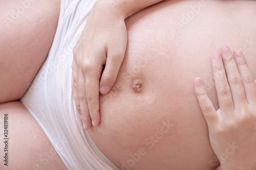 Close up of a pregnant woman's belly. Pregnacy concept. Pregnant belly.