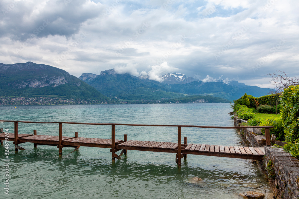 Annecy lake in French Alps in cloudy day. Beautiful landscape.