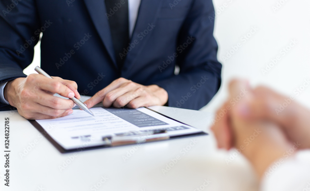 Business people hold resume documents, interviews for the work experience of young men applying as financial accountants for the company, Job interview and Job application..Concept... Business people hold resume documents, interviews for the work experience of young men applying as financial accountants for the company, Job interview and Job application..Concept...