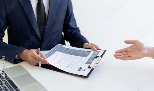 Business people hold resume documents, interviews for the work experience of young men applying as financial accountants for the company, Job interview and Job application..Concept...