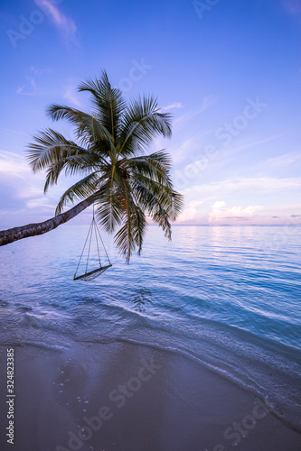 Wood swing beautiful sunset on the sea beach. Luxury sunset landscape  tropical nature view. Lounge swing over water  paradise  dream carefree concept
