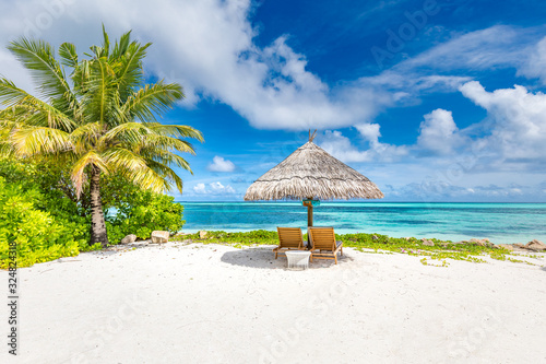Beach chairs and umbrella in paradise beach. Tropical vacation holiday banner, summer landscape