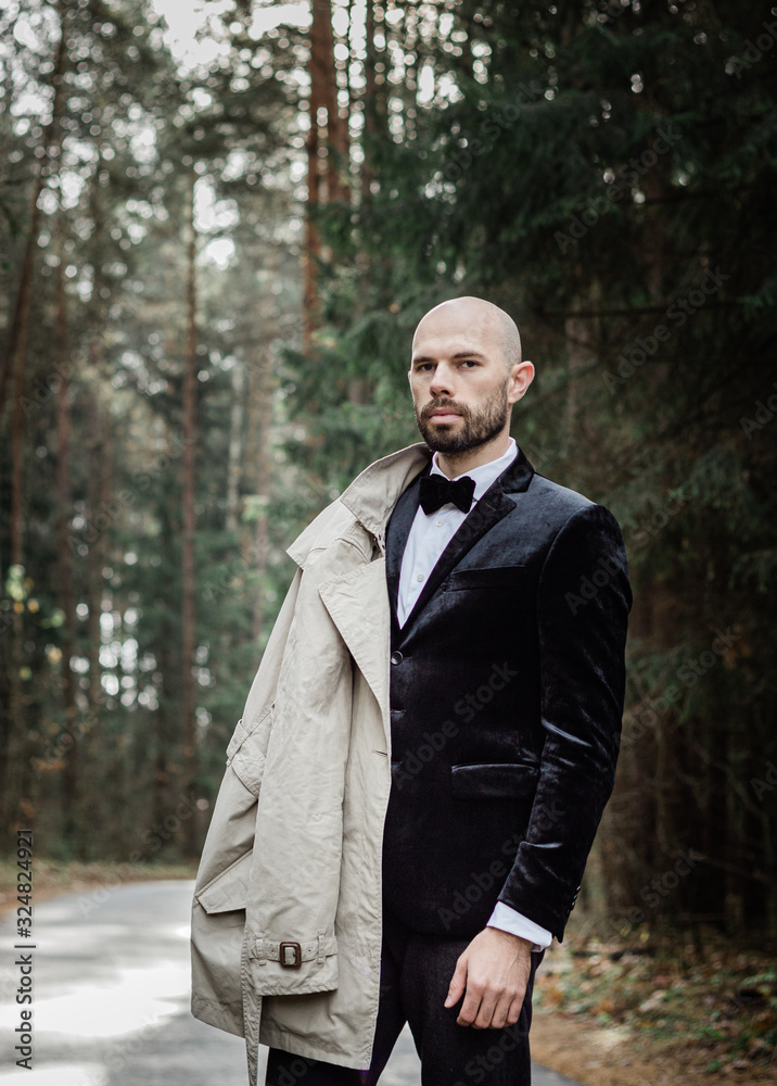 outdoors portrait of a middle-aged man in a business style in the forest outdoors portrait of a middle-aged man in a business style in the forest