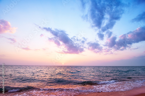 Beautiful seascape with cloudy sky. Sunset on the beach.