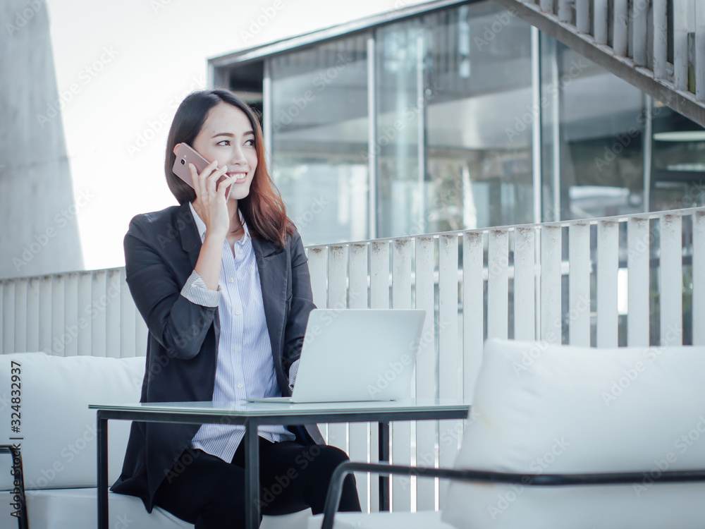 Asian business woman with laptop happy and smile concept success work Asian business woman with laptop happy and smile concept success work