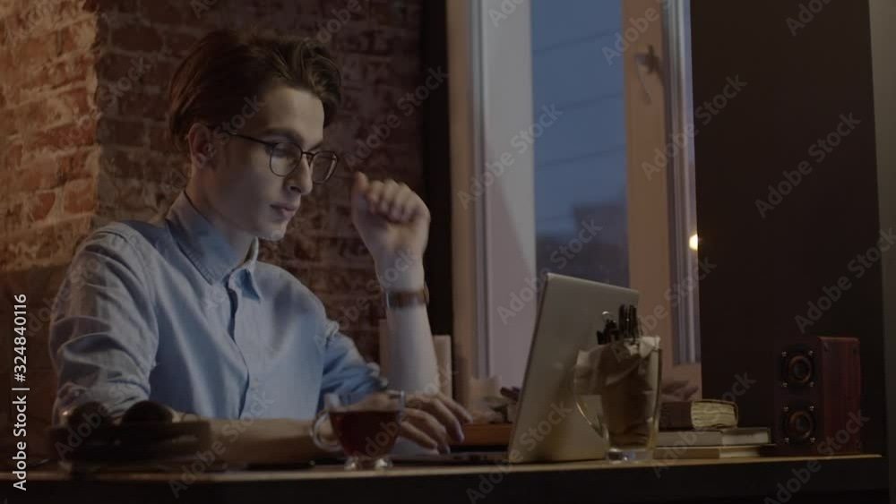 Young man working with laptop, slow motion Young man working with laptop, slow motion