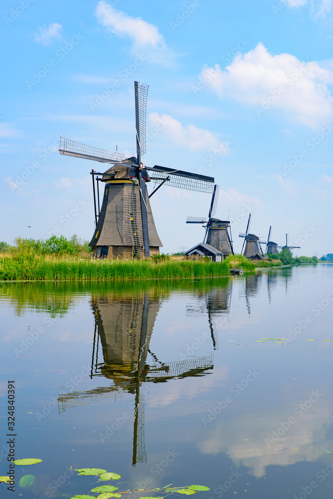 The windmills and the reflection on water in Kinderdijk, a UNESCO World Heritage site in Rotterdam, Netherlands The windmills and the reflection on water in Kinderdijk, a UNESCO World Heritage site in Rotterdam, Netherlands