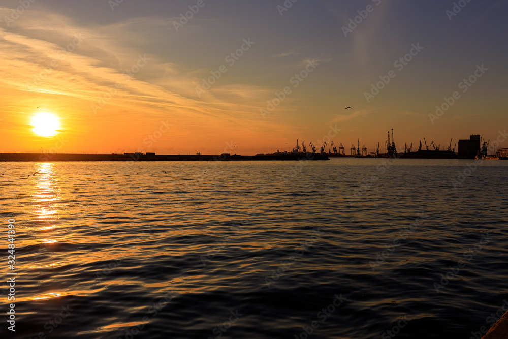 port at sea at sunset