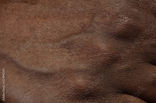 Fingers. Detailed texture of human skin. Close up shot of young african-american male body. Skincare, bodycare, healthcare, hygiene and medicine concept. Looks beauty and well-kept. Dermatology.