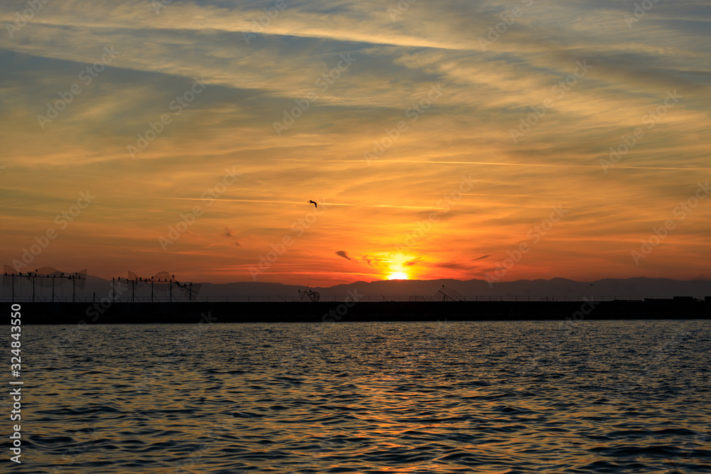 Naklejka premium winter sunset at sea in Thessaloniki