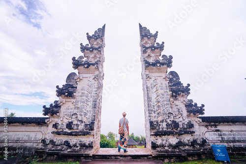 Architecture, traveling and religion. Traveler enjoying the view in Hindu temple Lempuyang in Bali, Indonesia