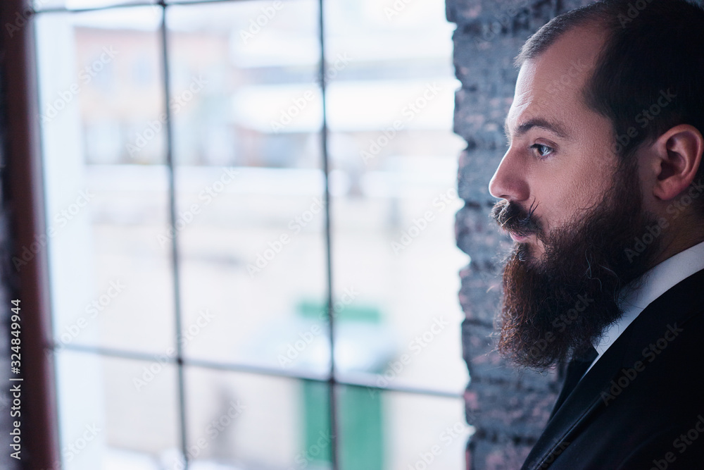 Gentleman fashion and style. Handsome young bearded man at suit and tie. Gentleman fashion and style. Handsome young bearded man at suit and tie.