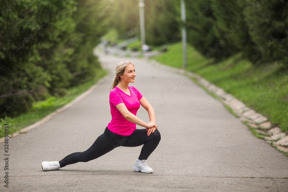beautiful young woman in sports pink t-shirt goes in for sports beautiful young woman in sports pink t-shirt goes in for sports