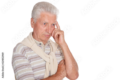 Portrait of thoughtful senior man isolated on white background