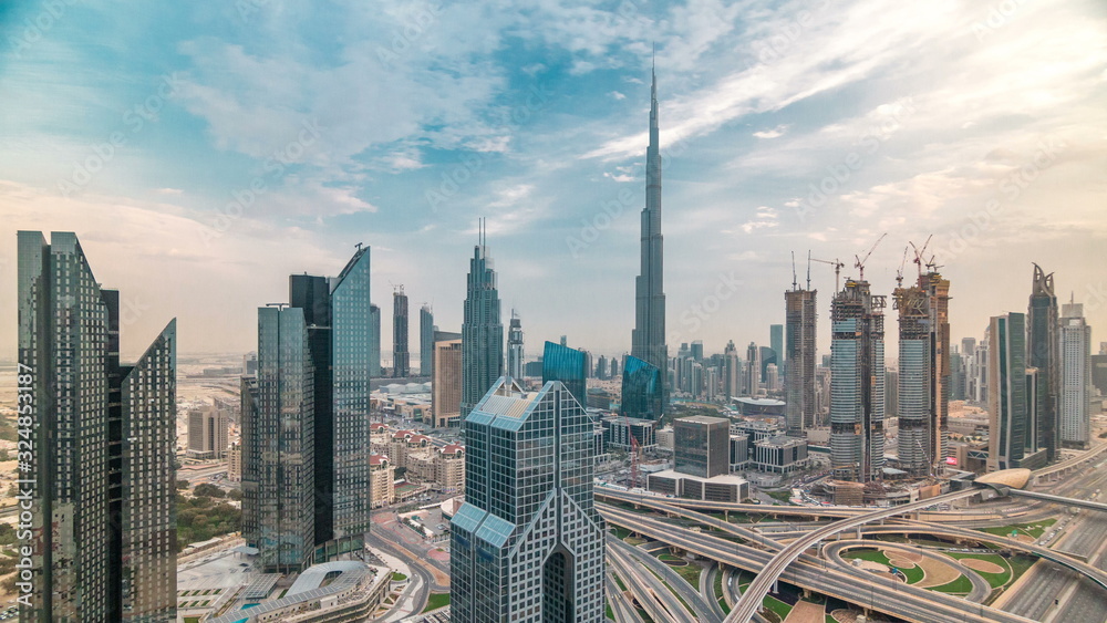 Dubai skyline timelapse at sunset with beautiful city center skyscrapers and Sheikh Zayed road traffic, Dubai, United Arab Emirates Dubai skyline timelapse at sunset with beautiful city center skyscrapers and Sheikh Zayed road traffic, Dubai, United Arab Emirates